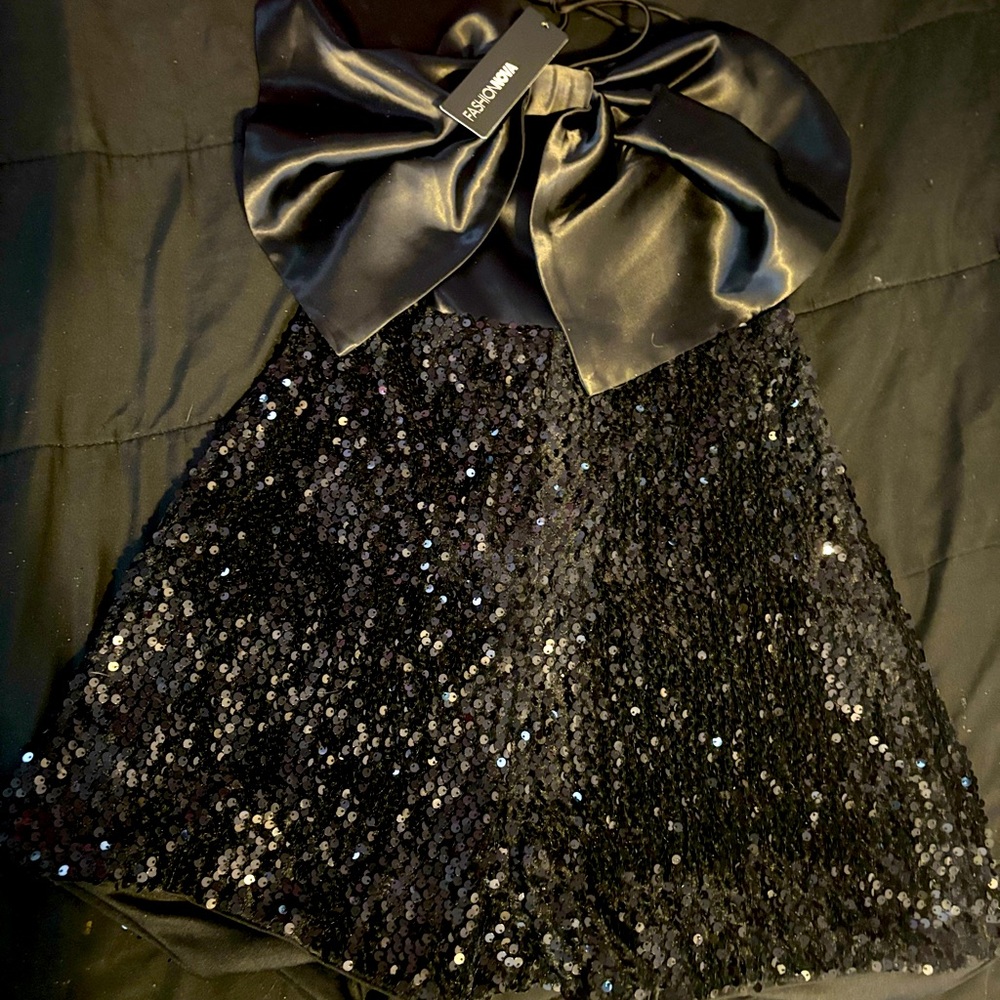 Fashion Nova black silky sequins romper. Never worn. Tag still on
